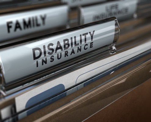 File with focus on the text Disability Insurance and blur effect. Concept of individual protection.