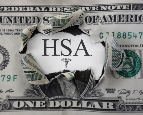 Torn dollar with HSA ( Health Savings Account ) paper message